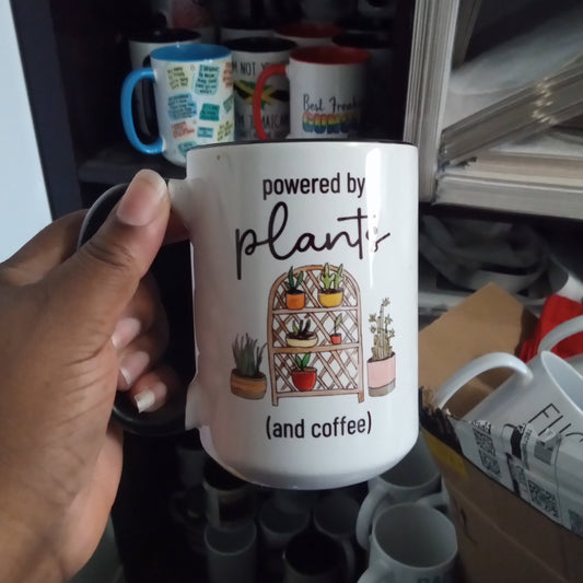Powered by plants and coffee mug (15oz black inner/handle mug w/imperfections)