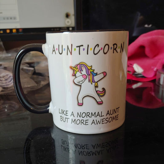 Aunticorn (11oz black inner/handle mug w/design on one side, blue speckles on mug) TNDCanada